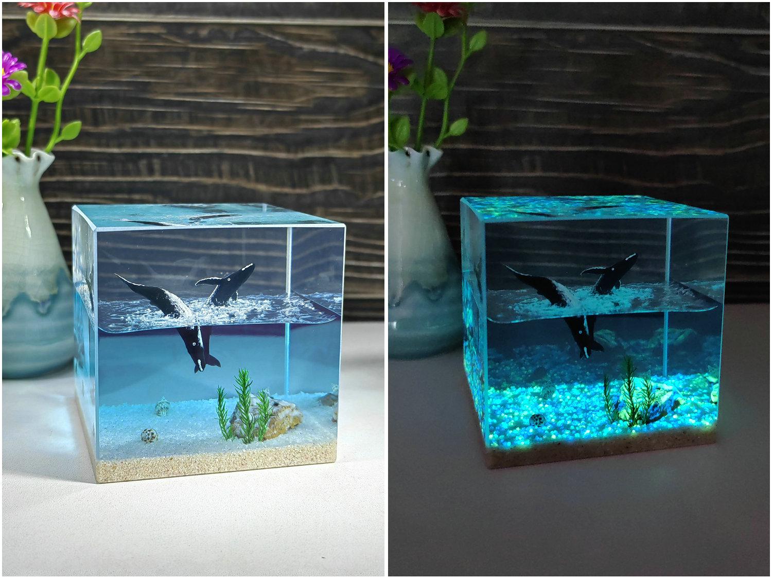 Handmade resin diorama featuring breaching humpback whales and a glowing underwater world