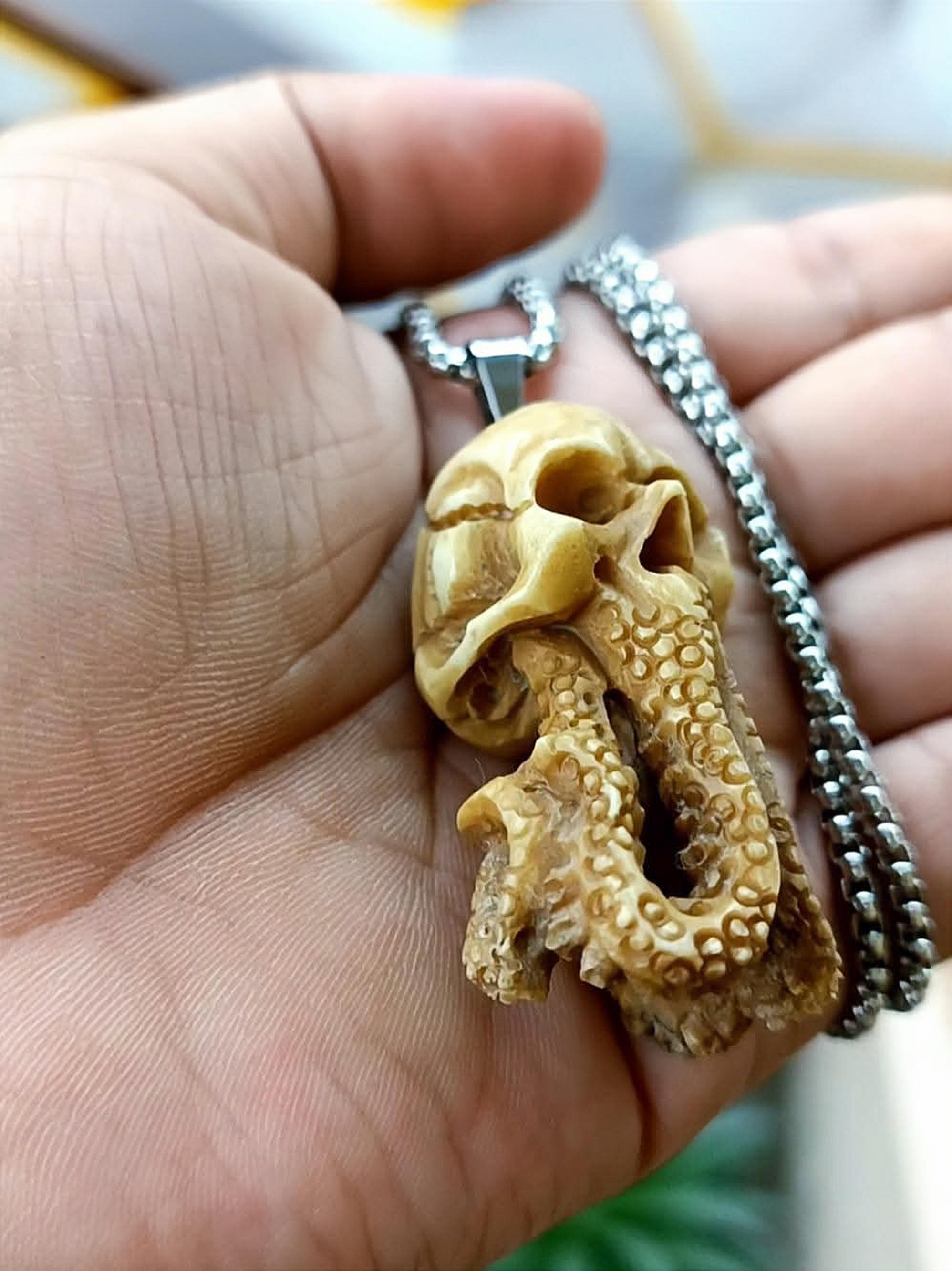 Hi all!! I just want to show my artwork An octopus pendant made from carved deer antler. What do you think?